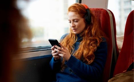Girl on train using a phone