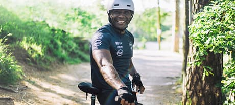 Man on bicycle smiling