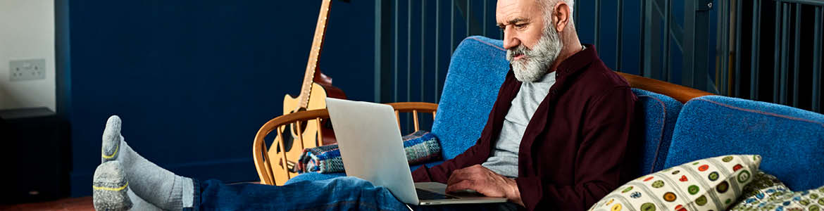 man looking on laptop