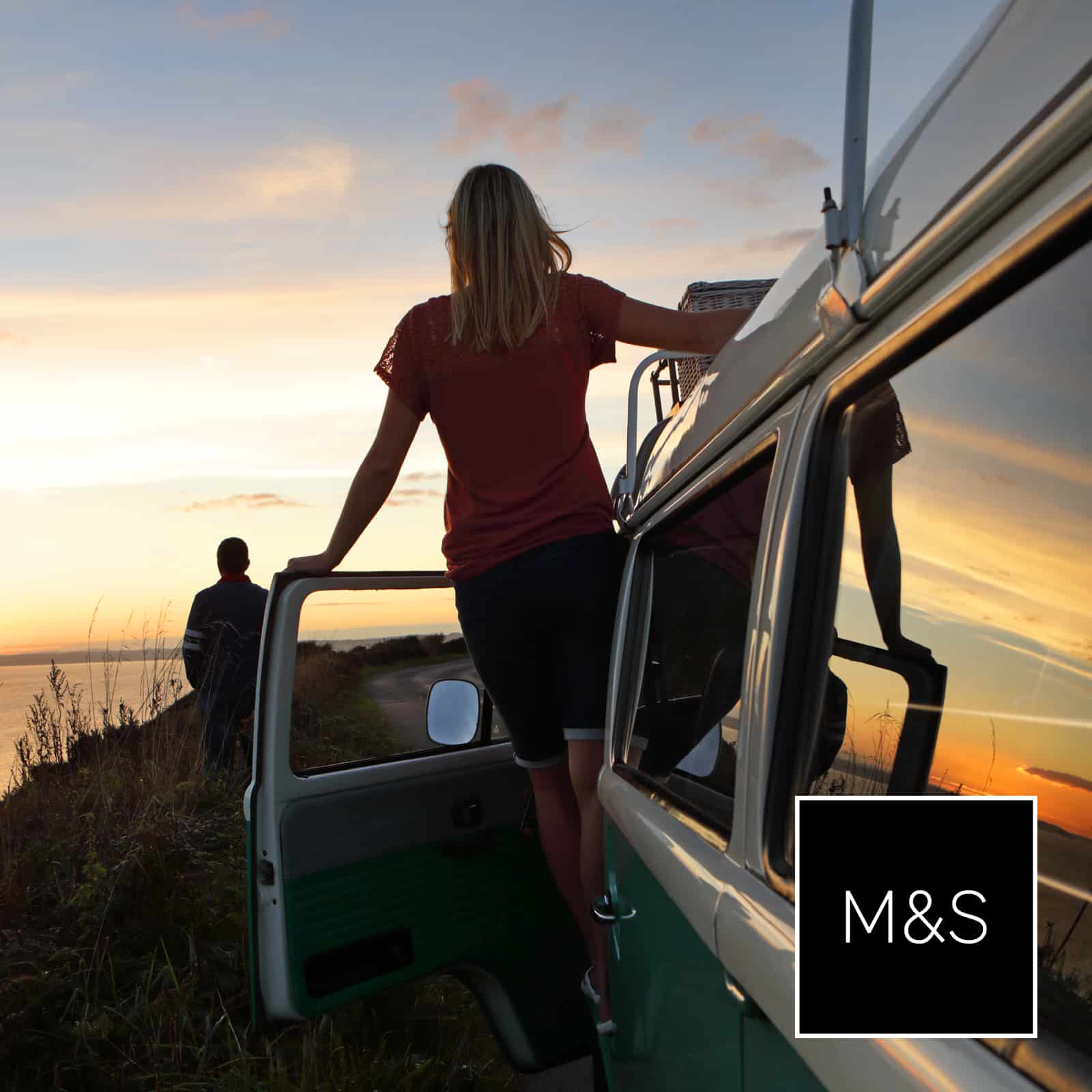 Woman watching the sunset from her campervan, overlaid with the Marks & Spencer logo