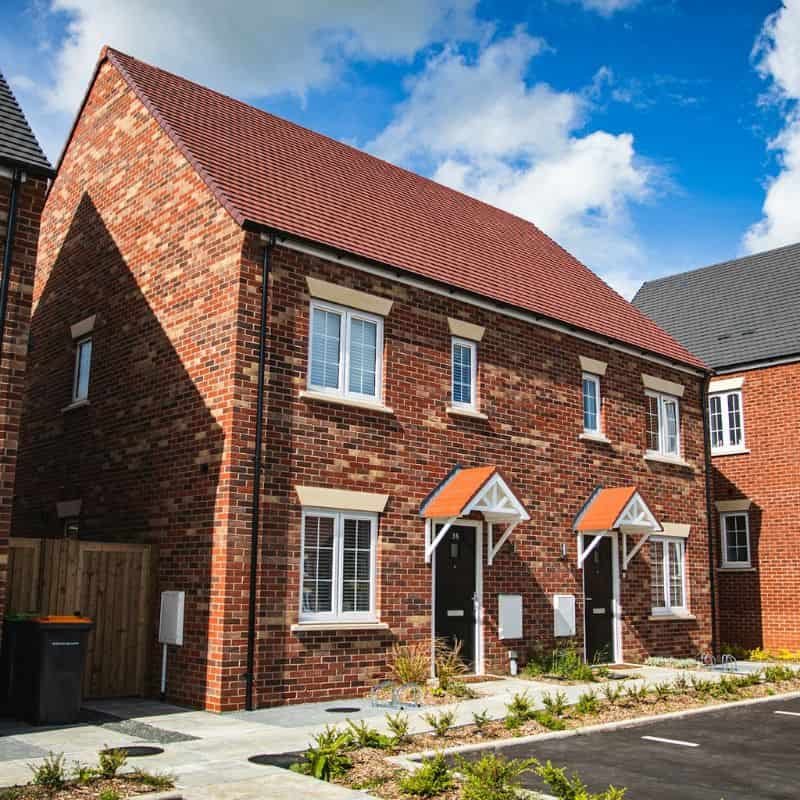 Two new-build, mixed-brick, semi-detached houses