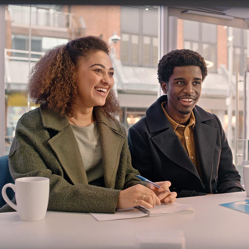 Smiling young couple in a Skipton branch