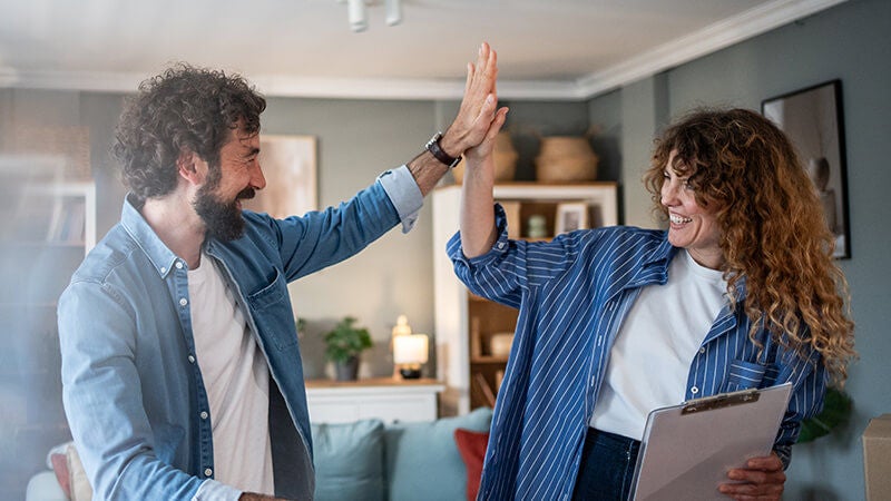 Smiling couple high-fiving